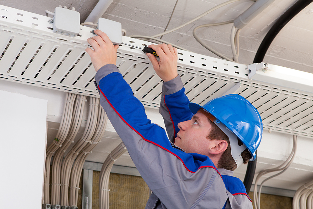 A technician organizes network cables 